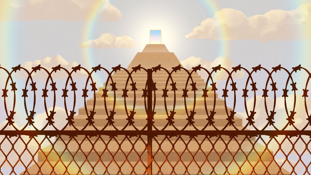 A door at the top of stairs, with a barbed wire fence blocking its access.